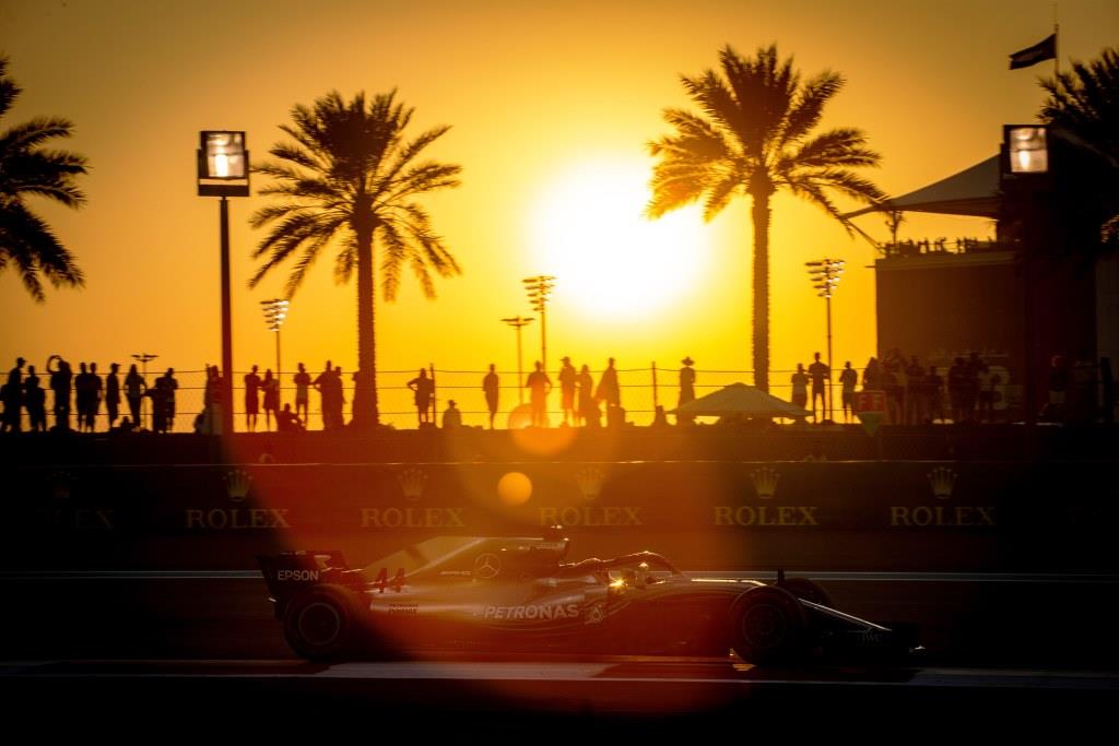 sunset between palm trees